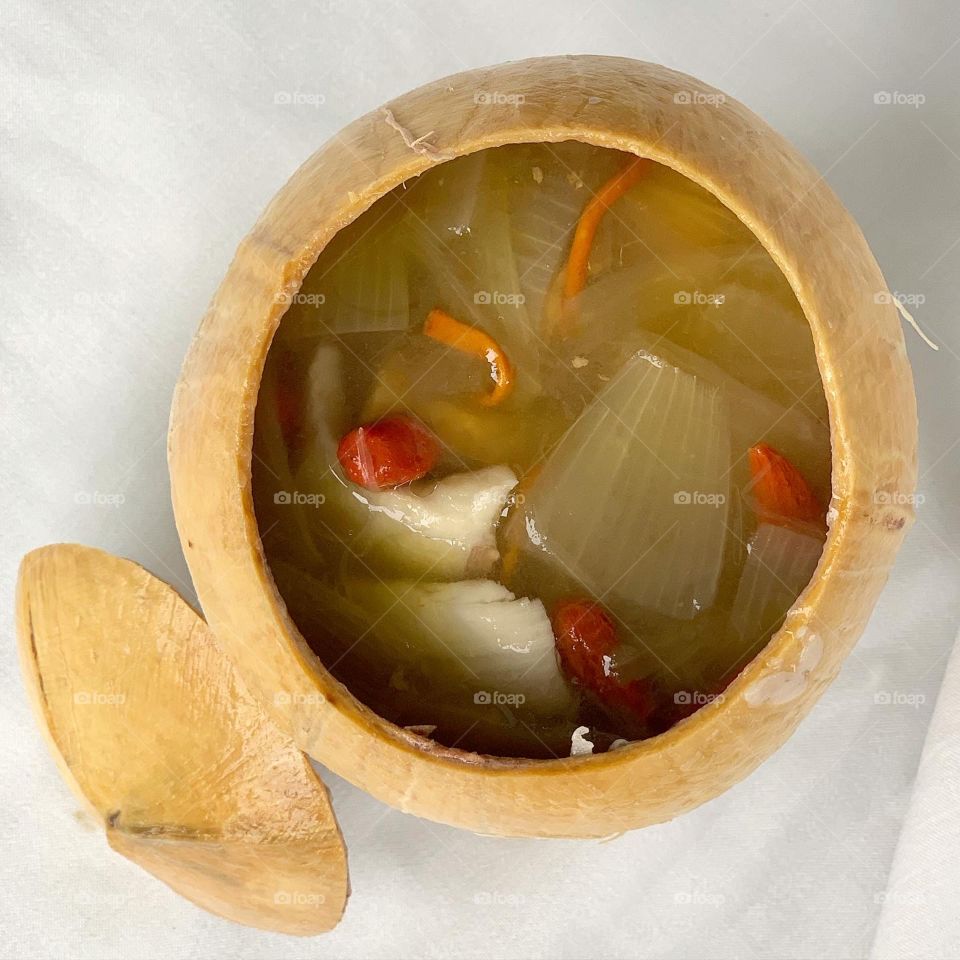 Chicken Cordyceps soup with mushroom in coconut husk 