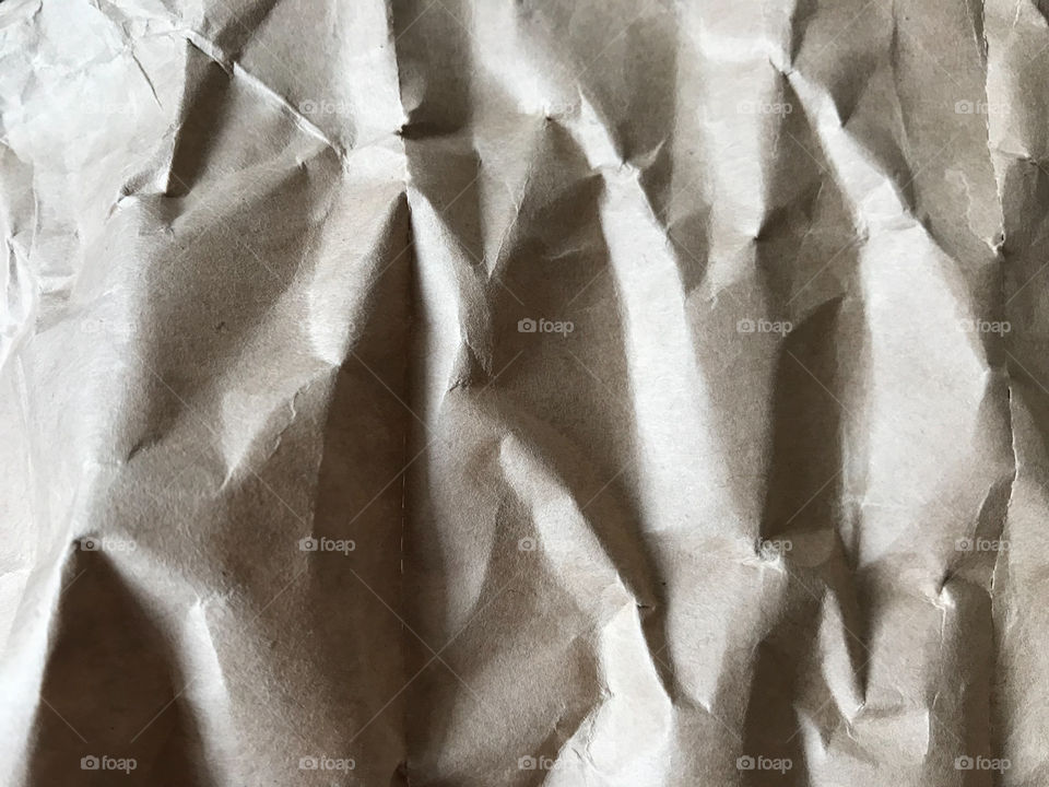 brown crumpled paper looks like rock, using as background