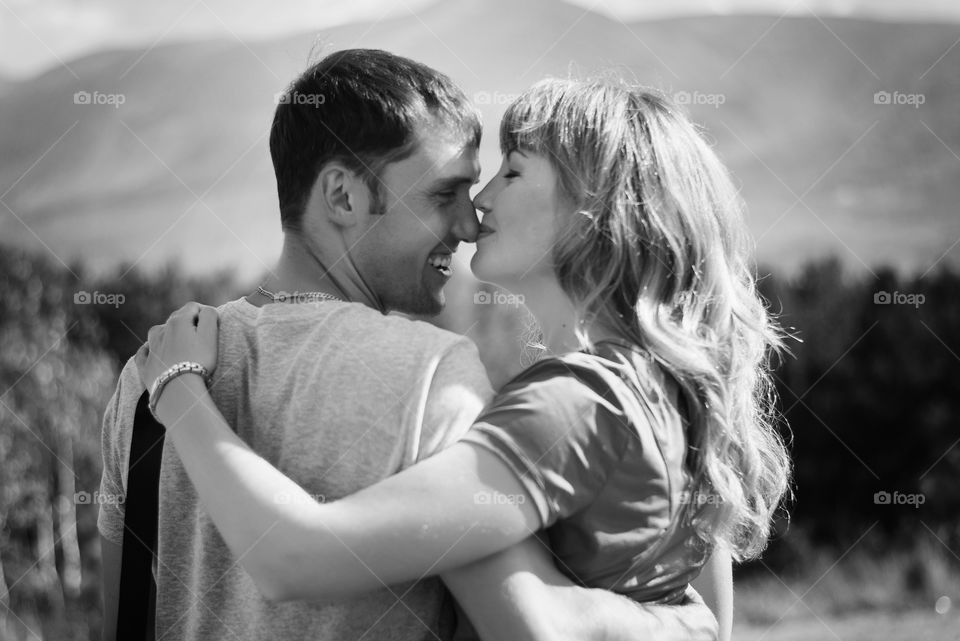 Woman kissing her man on nose