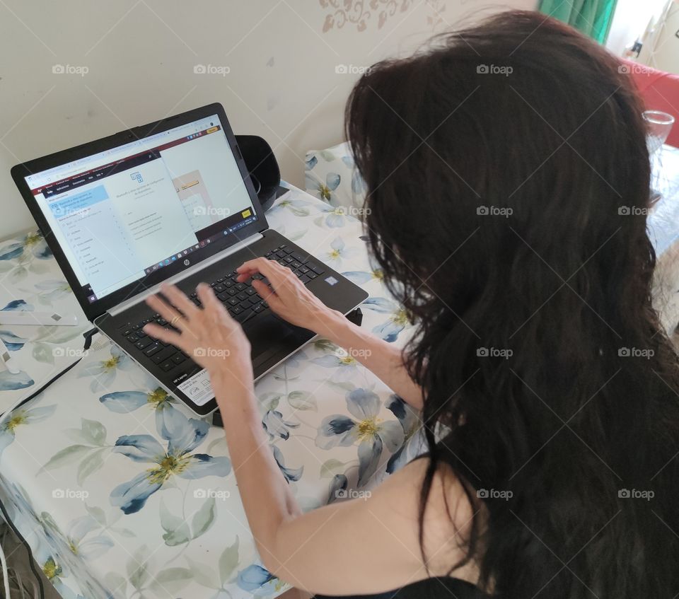 A woman on her laptop working