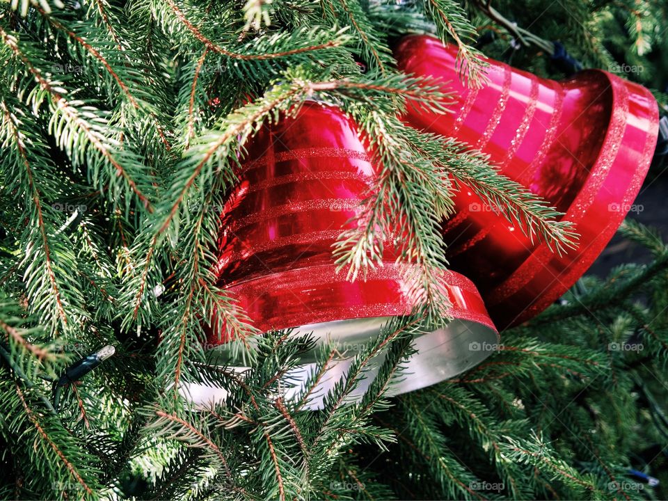 Red jingle bells on christmas tree