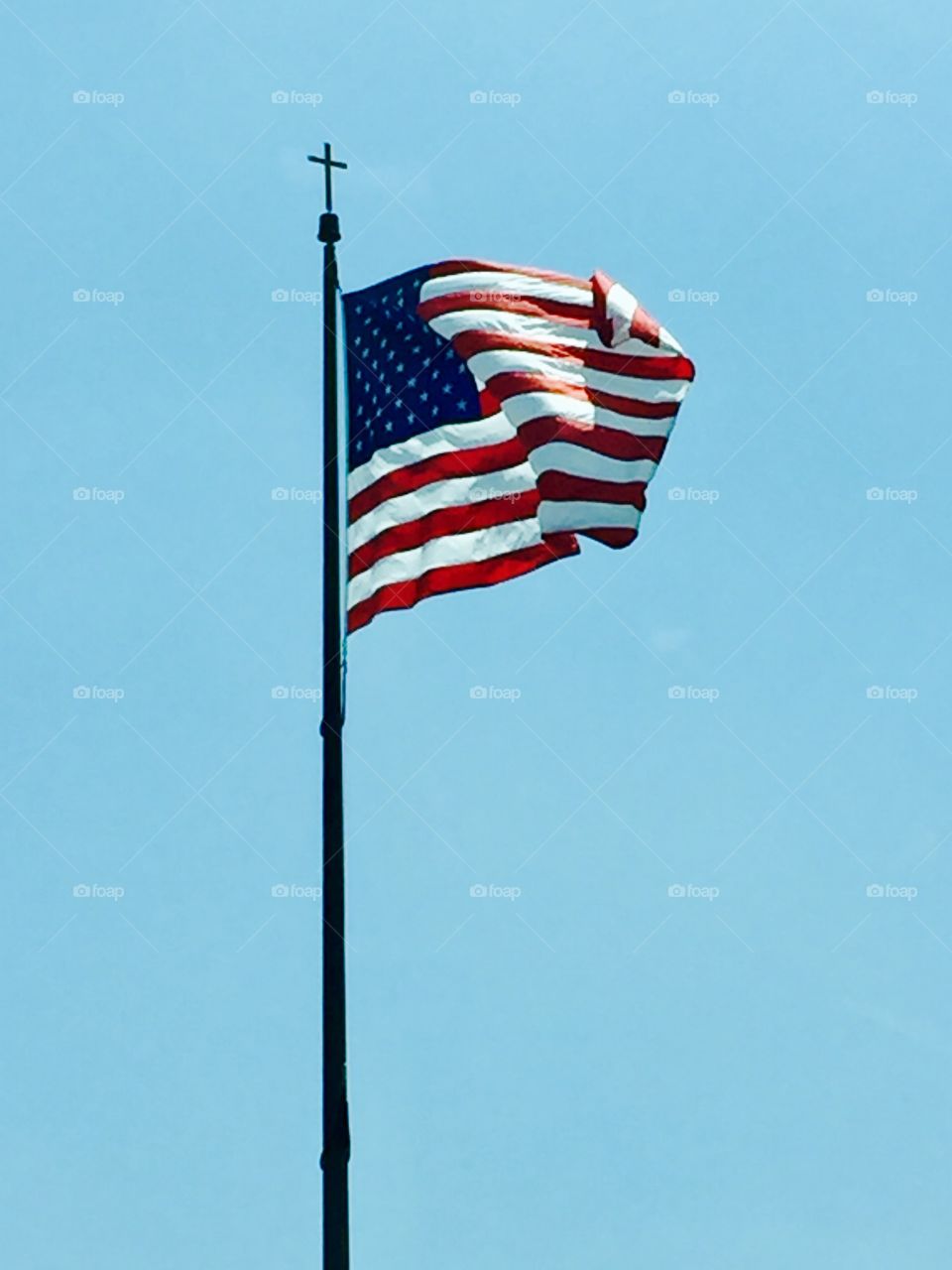The American flag With a cross on it