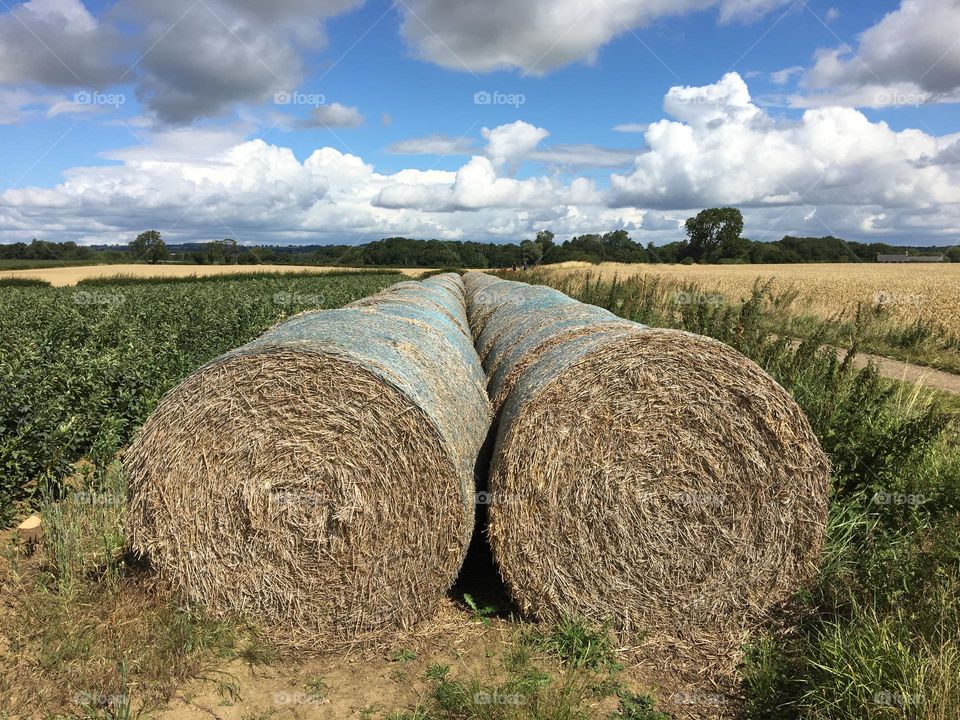 Bales of hay forming a circle shape in the countryside