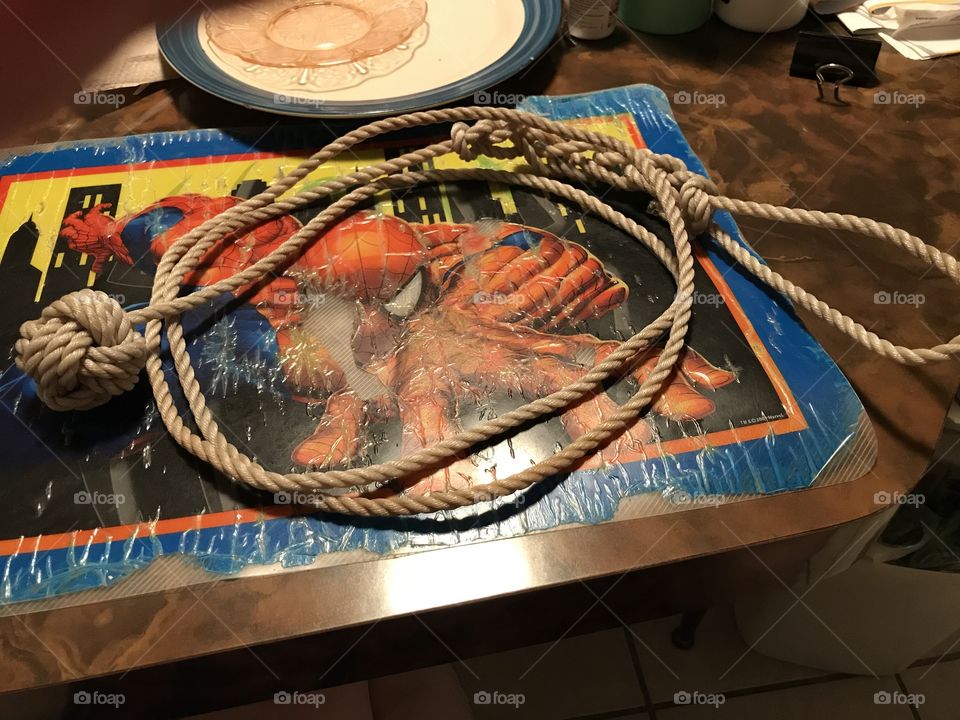 A homemade monkey fist with a long cord, handle and loop at the end. Makes a fine cord weapon with the monkey fist simulating a striking weighted ball. Also, makes a good workout implement.