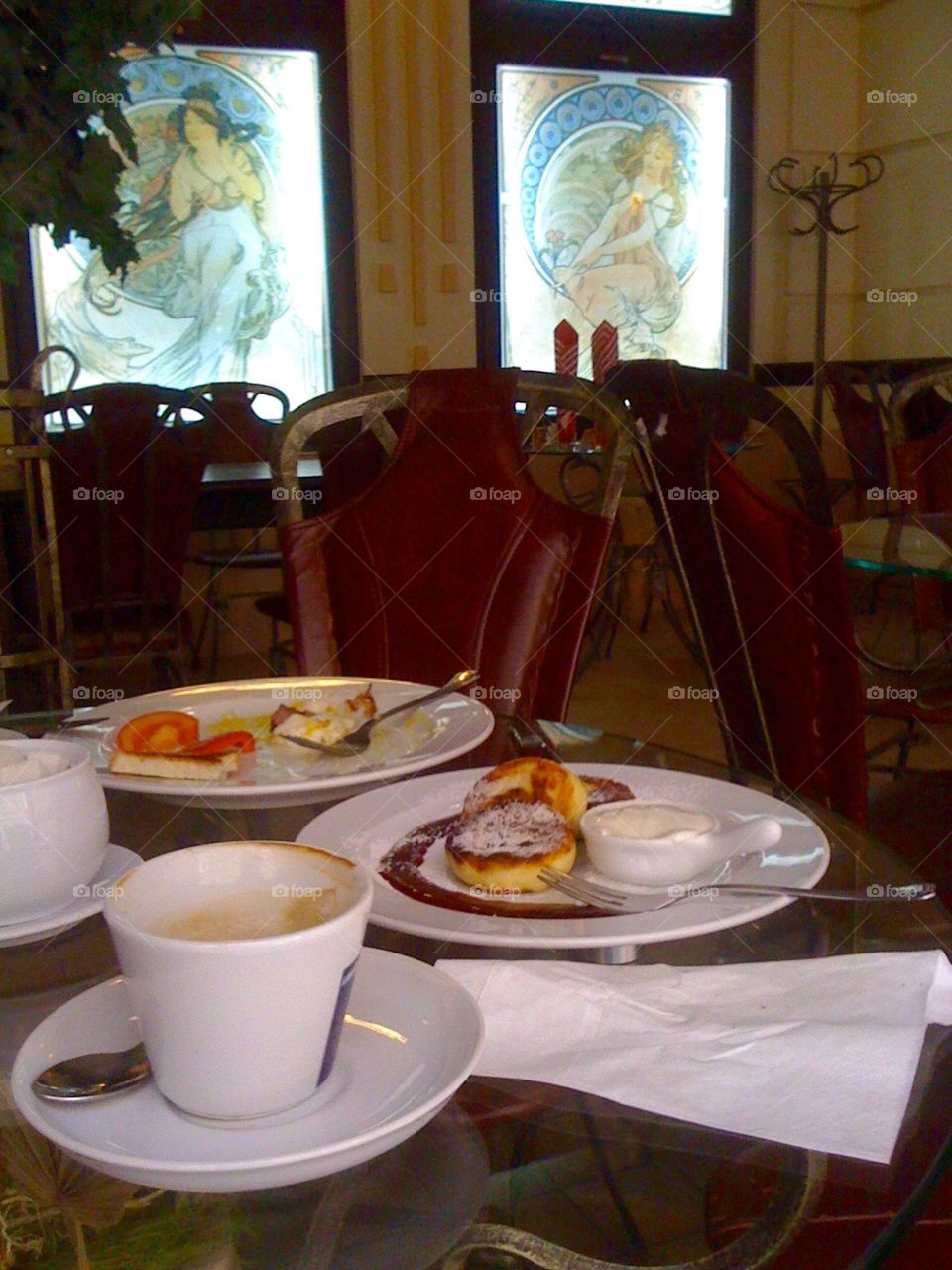 Dishes on a table in a cafe with retro furniture