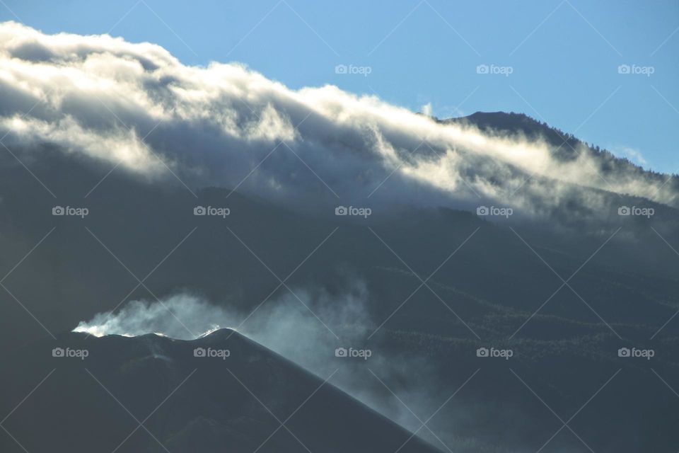 The Tajogaite volcano on La Palma surrounded by clouds and smoke