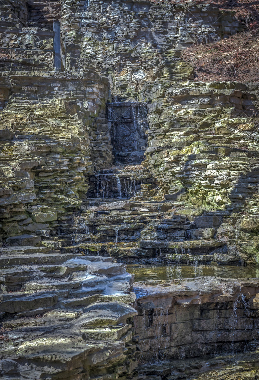 Local park waterfall in spring. Sheet rock waterfall in a local park Milwaukee Wisconsin