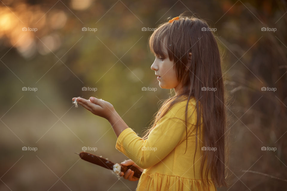 Little girl in yellow dress outdoor portrait 