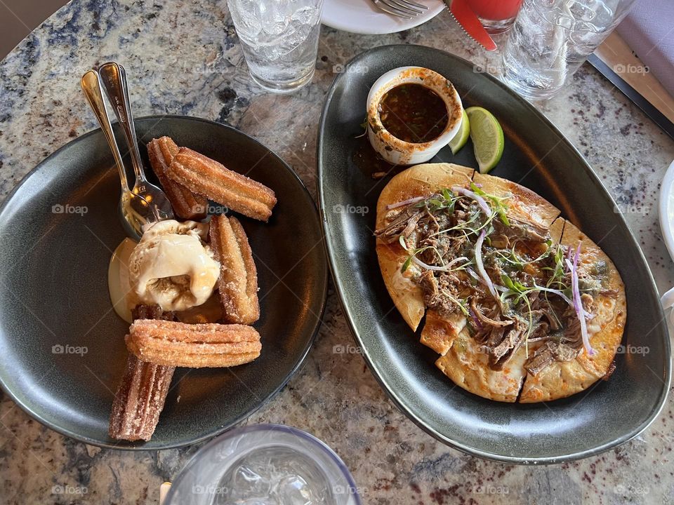 Food at Disneyland . Birria flatbread with churro ice cream 