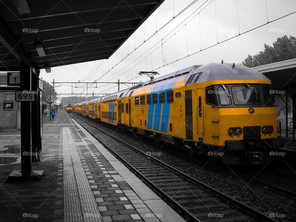 yellow train railway rain by nvr