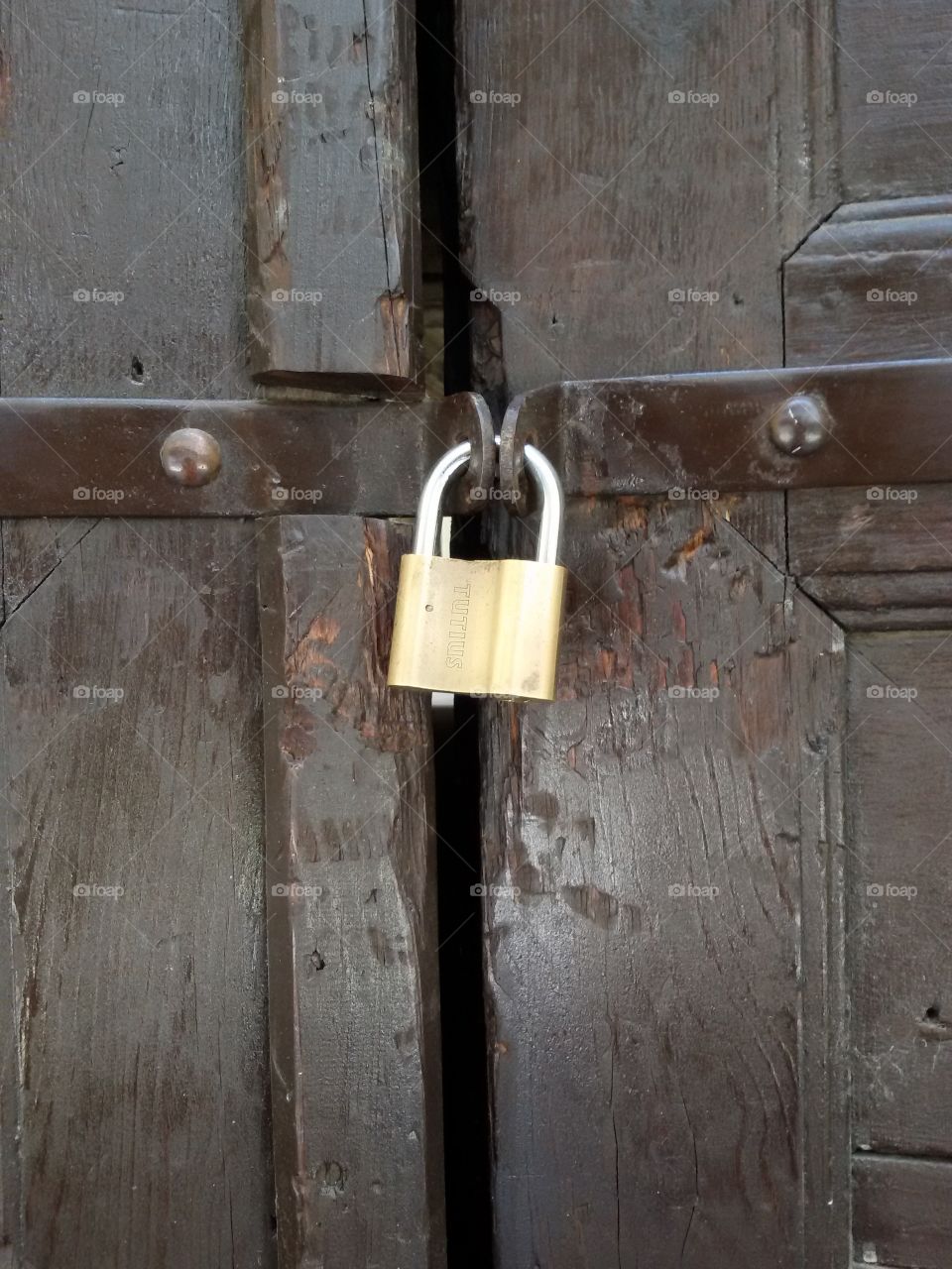 Large yellow padlock on door