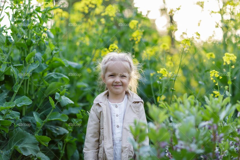 Lifestyle portrait of little Caucasian girl feeling disgust