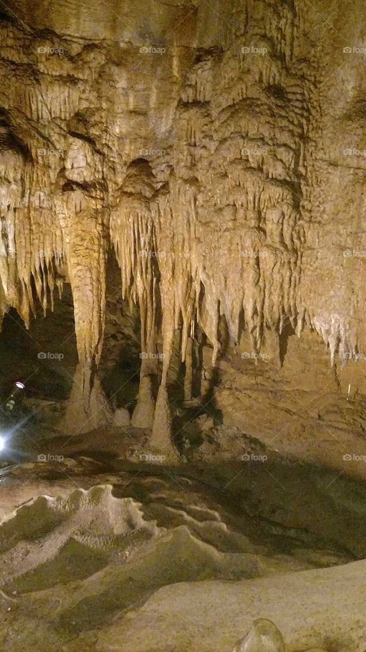Imposing stalagtites suspended over an inner chamber of the cave system winding underneath Mammoth National Park in Kentucky.