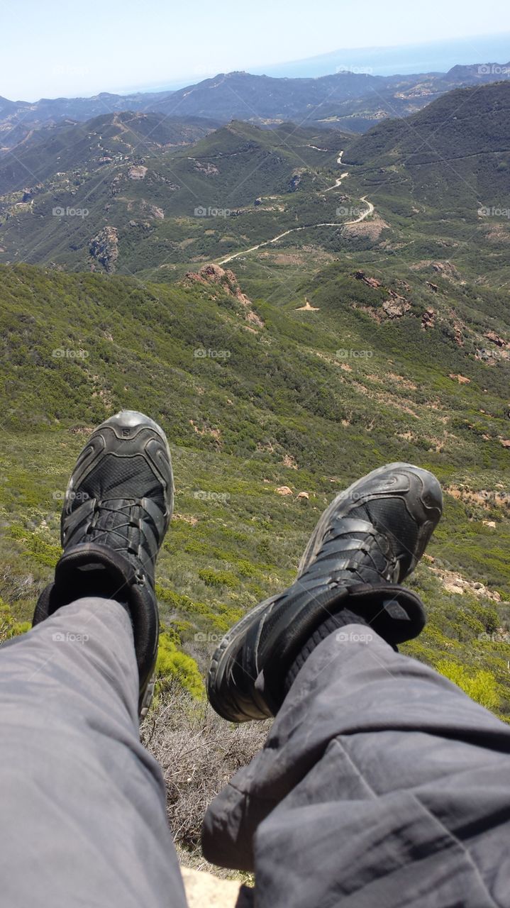 hiking feet from mountain top