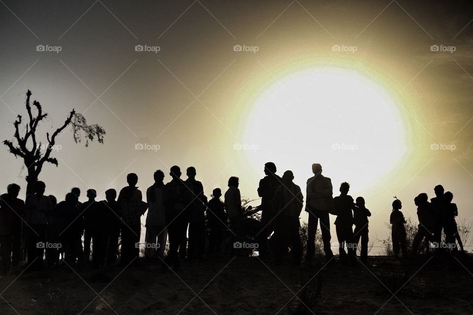 Silhouette at sunset . thar desert, india 