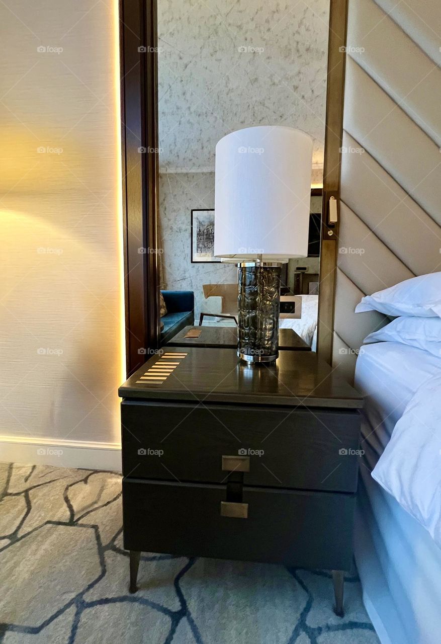 Brown bedside table with table lamp