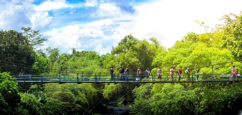 together crossing the bridge