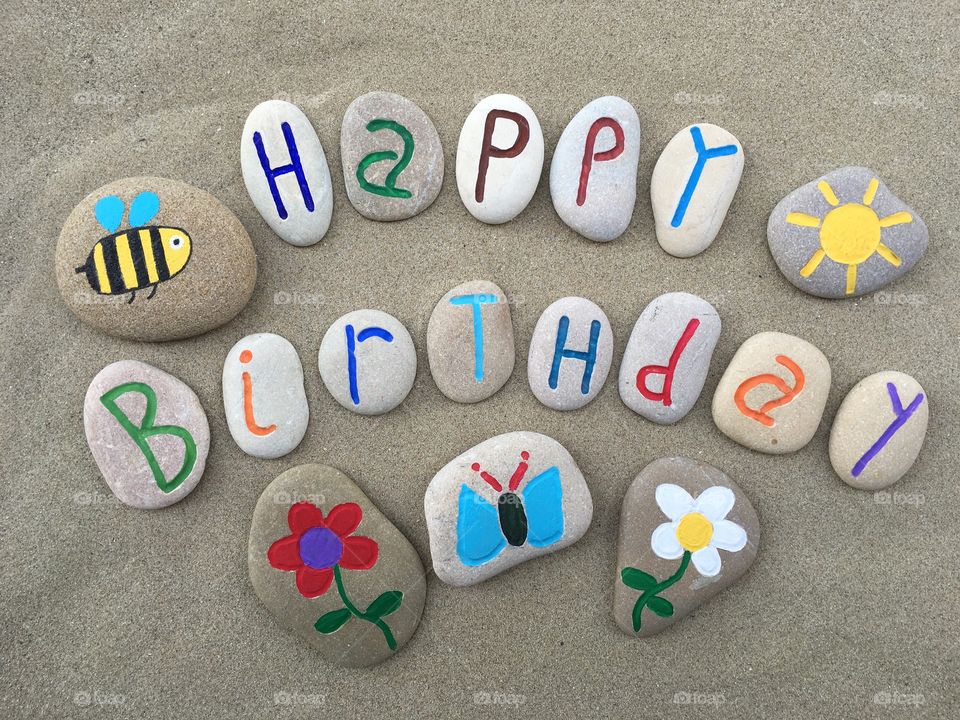 Happy Birthday message with stones composition