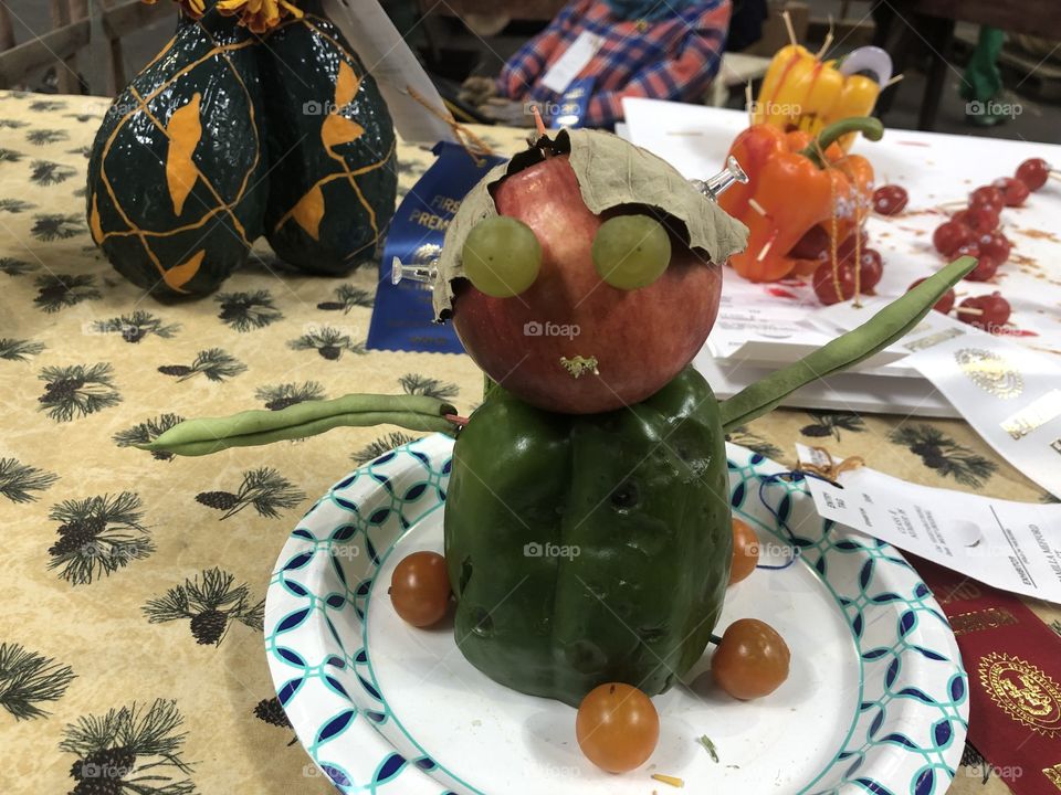 A art project with vegetables making people