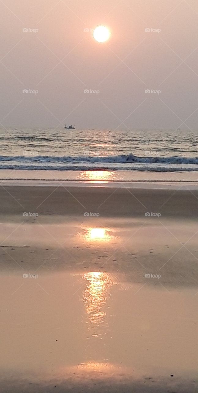 sunset on the beach of Leela Goa