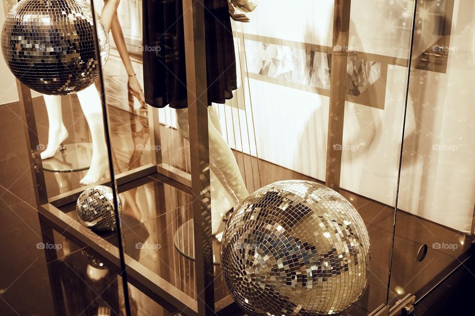 Showcase disco ball illuminated dummy fashion dress decoration celebration close-up