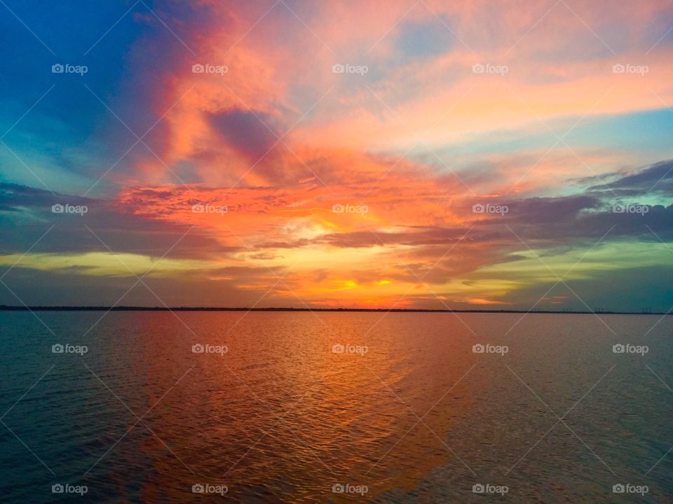Idyllic sea with dramatic sky at sunset