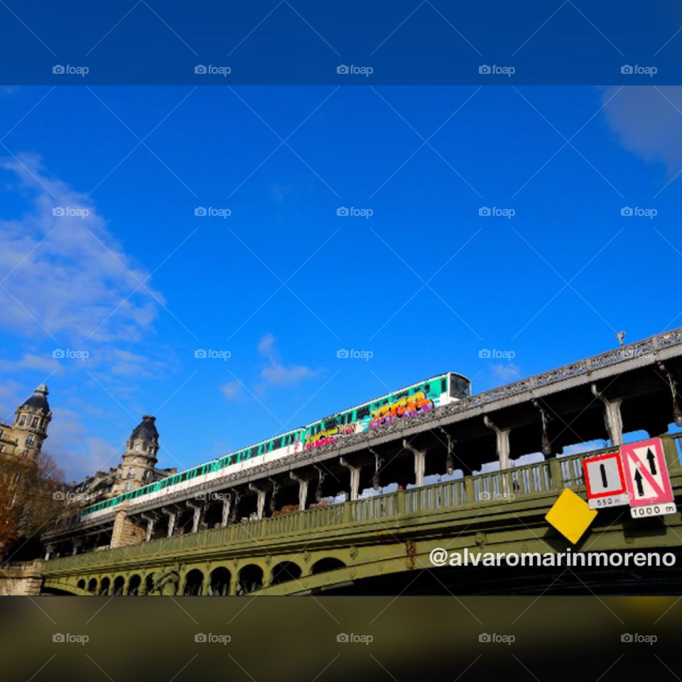 Metro train in Paris,France.Shot from a bateau mouche in the seine river.