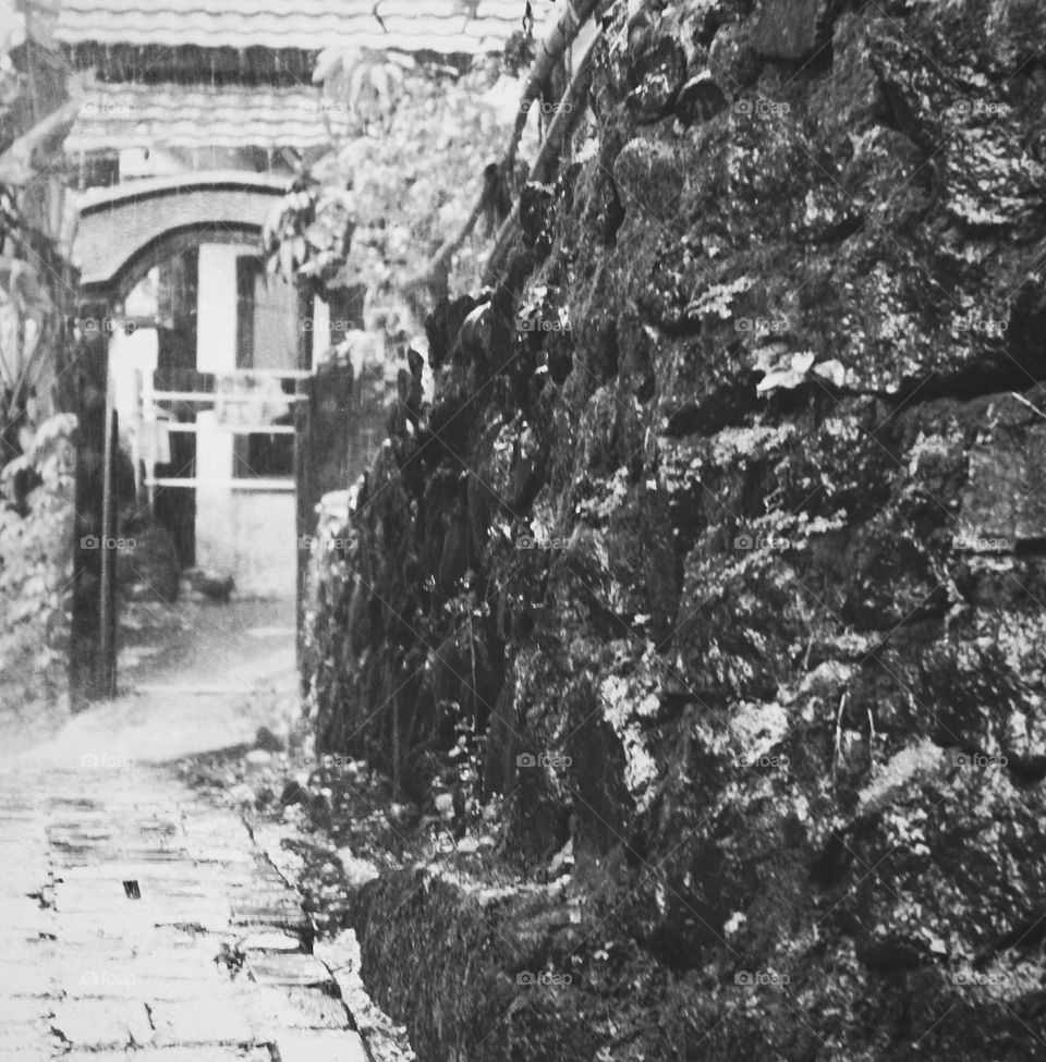 This wall is a sign of the boundaries of the residents' gardens and the path is narrow so that it cannot be passed by four-wheeled vehicles but with the concrete wall, residents still accept what is