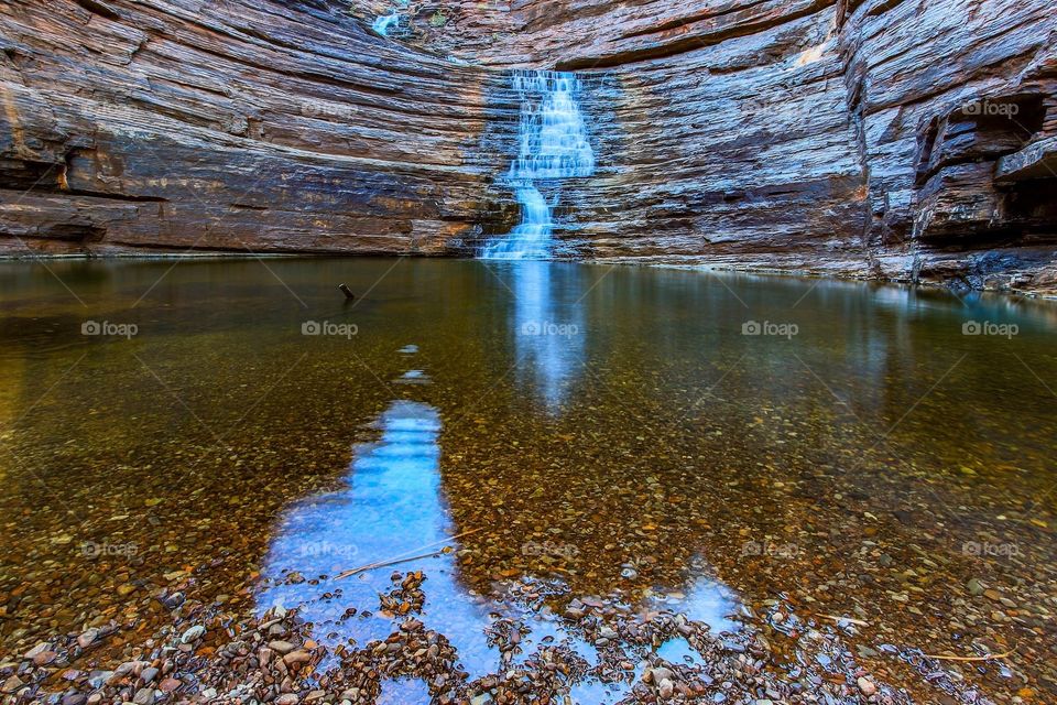 Rocky waterfall and clear pool