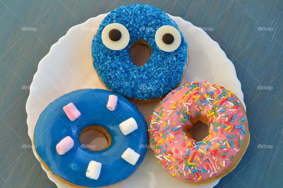 Three colorful donuts