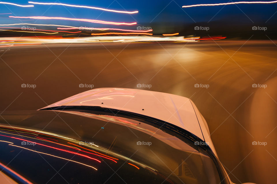 Car moving on the road, motion blurred by slow shutter speed 