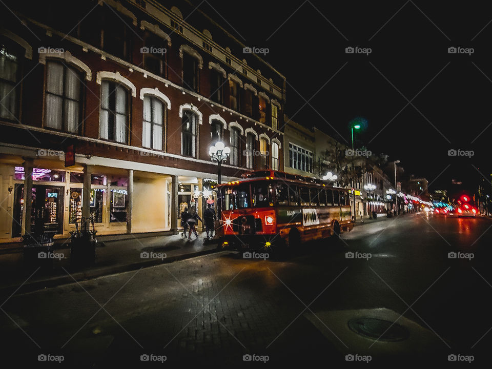 Urban landscape - red city trolly at night