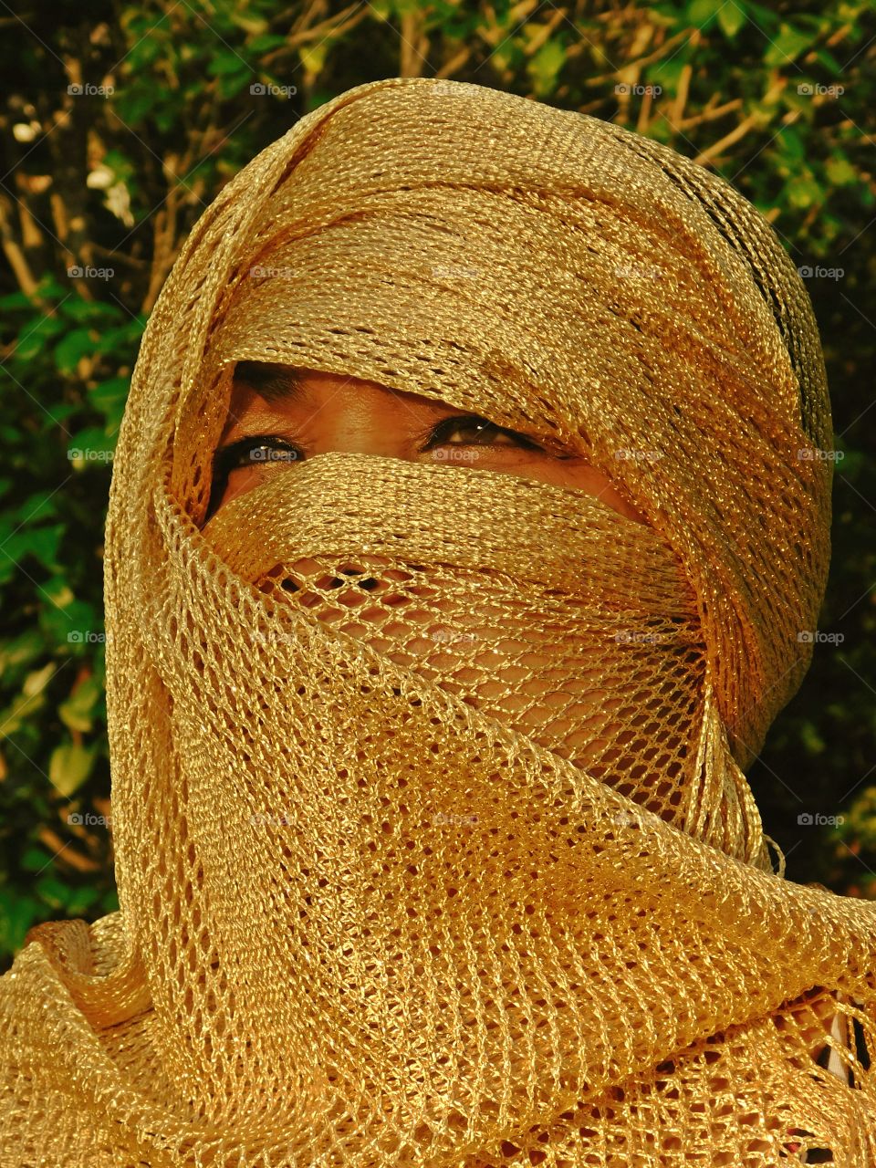 A women wearing a gold colored hijab - I love this photo - A portrait of a beautiful woman dressed in a gold veil. Principle of modesty, facial cover, gold, color of gold, chic, classy, head, face, golden, eyes, head, facial expression