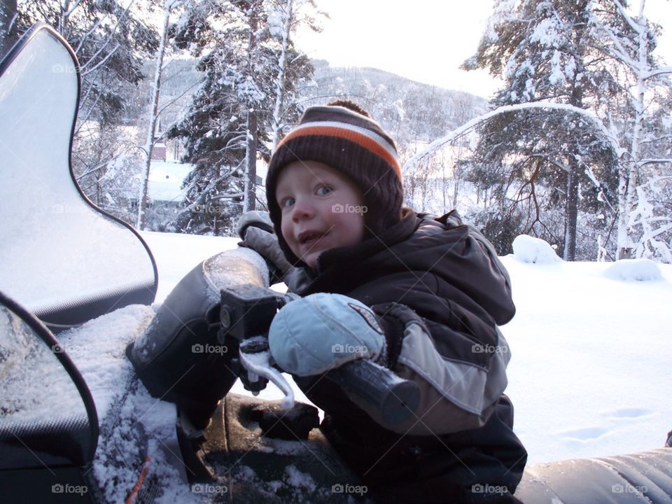 Boy on snowmobile