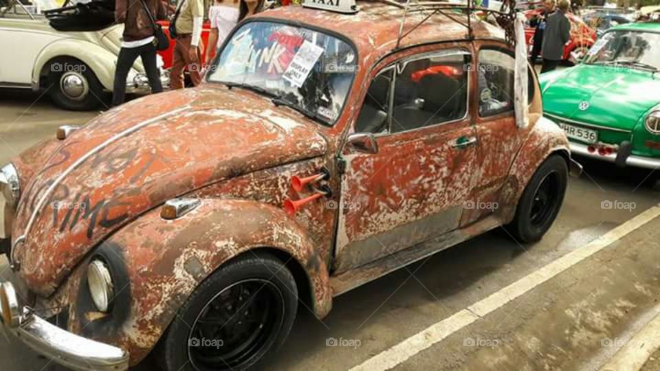 The rustic design of the minicooper blossoms the beauty of the car. Made it look prettier and vintage.