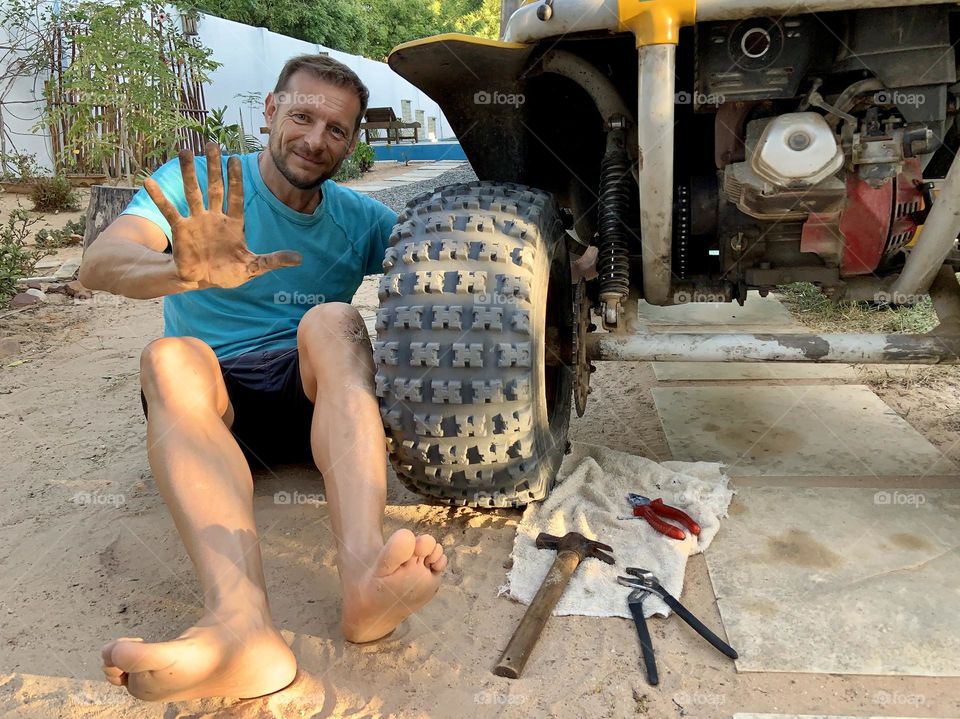 Under the hood. Man working 