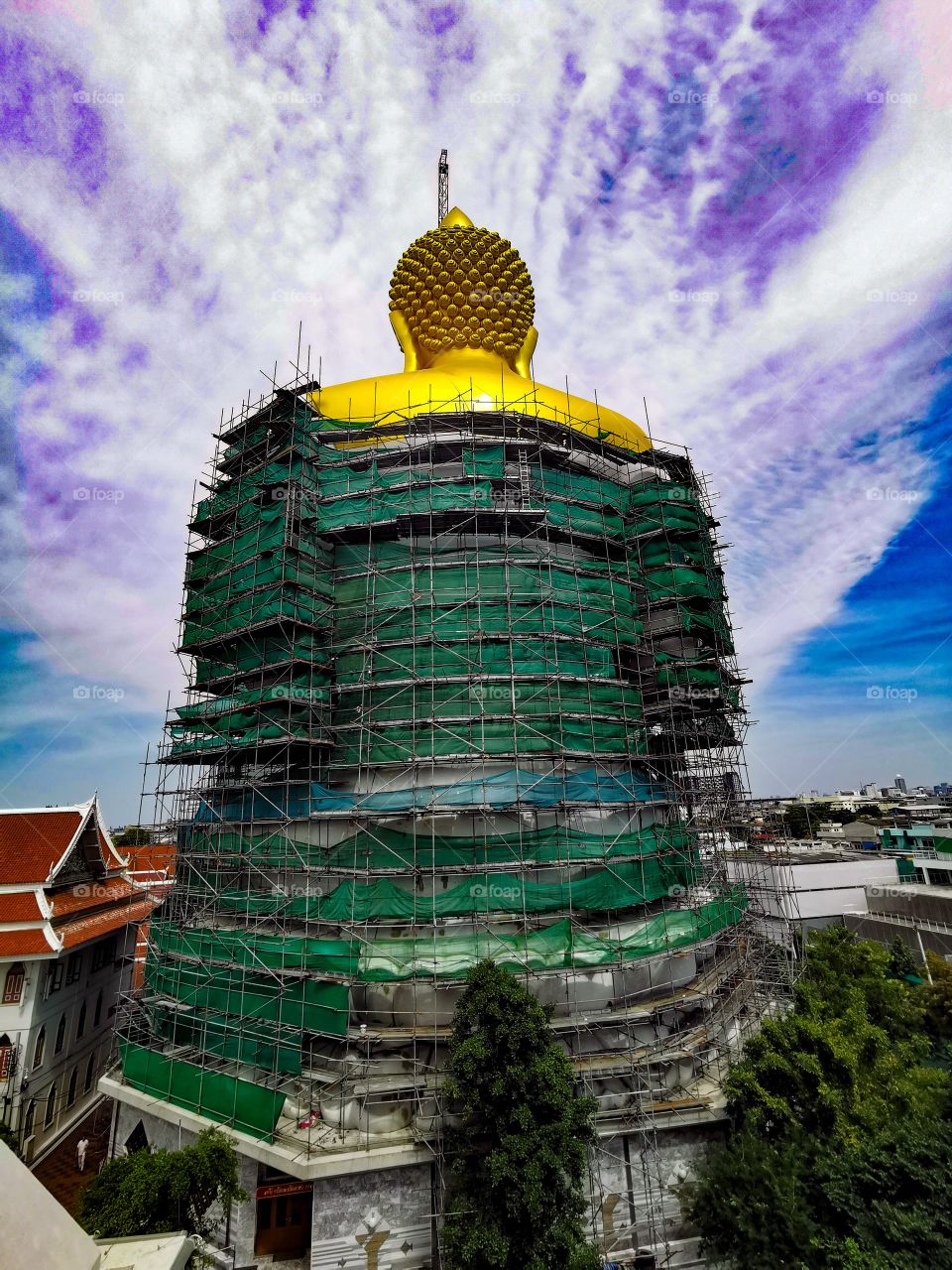 The giant Buddha at Wat Paknam, seen from behind. It is currently still under construction and stands at over 90 metres tall.