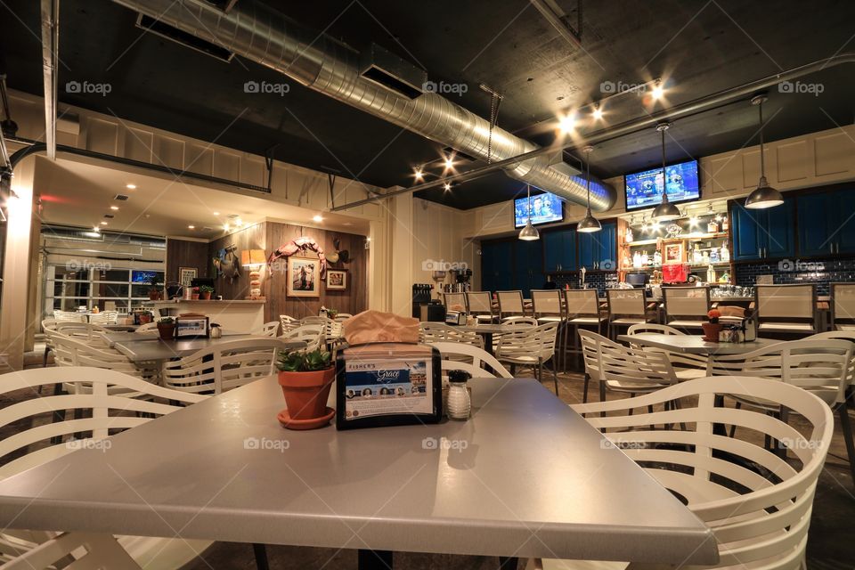 Table inside restaurant at night with nobody 