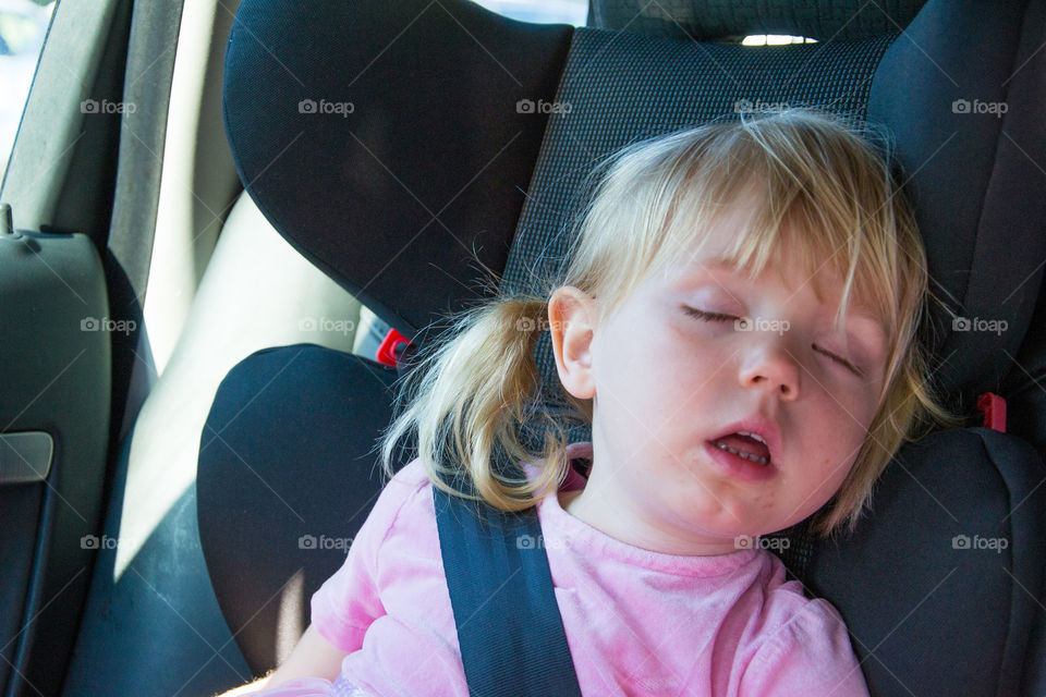 Sleeping child in car.