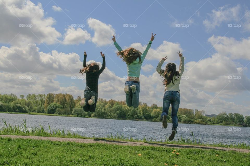 Three best friends jumping for joy and celebrating life