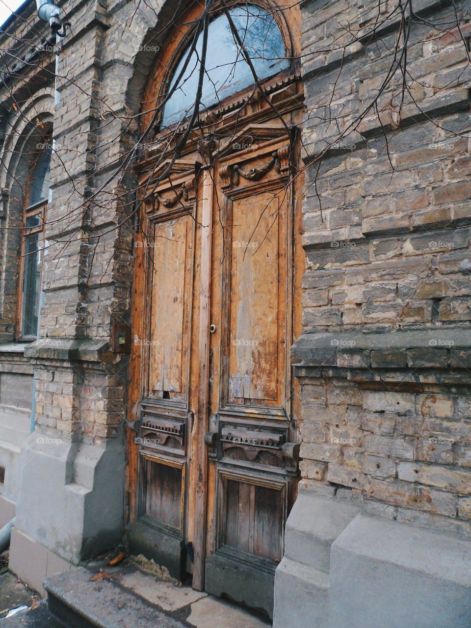 old wooden door in a brick house