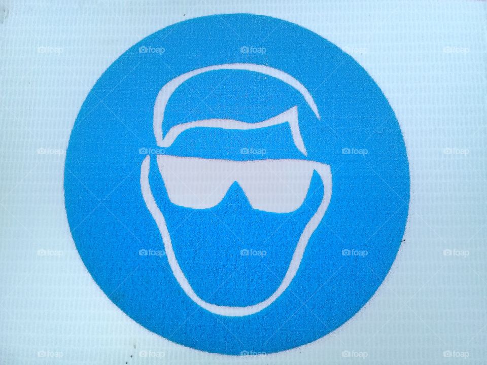 This picture is a warning sign use glasses