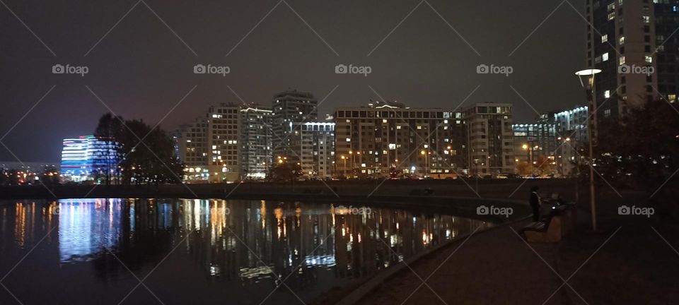 night city wiev beautiful lights and reflection in river