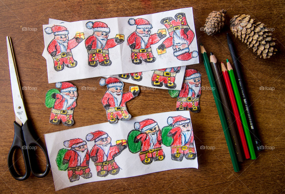 Making of paper figures of Santa Claus for Christmas