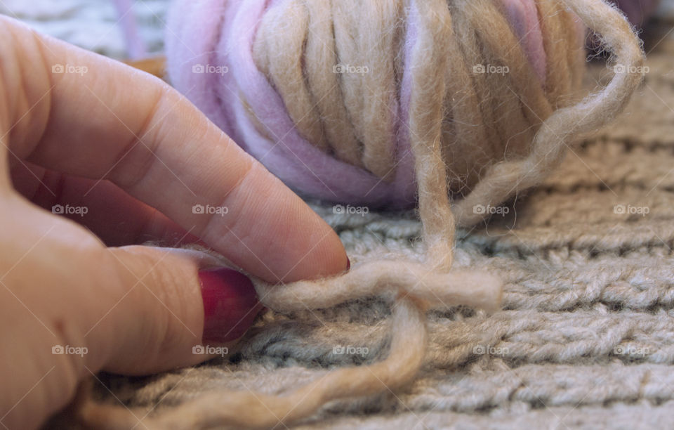 Women's hand holding woollen