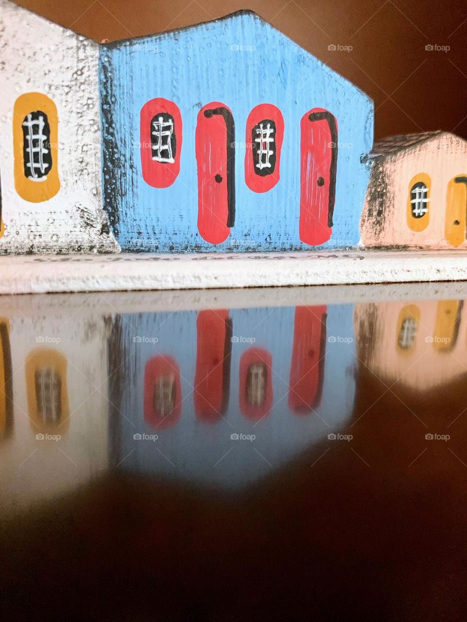 Reflection of decorative mini houses