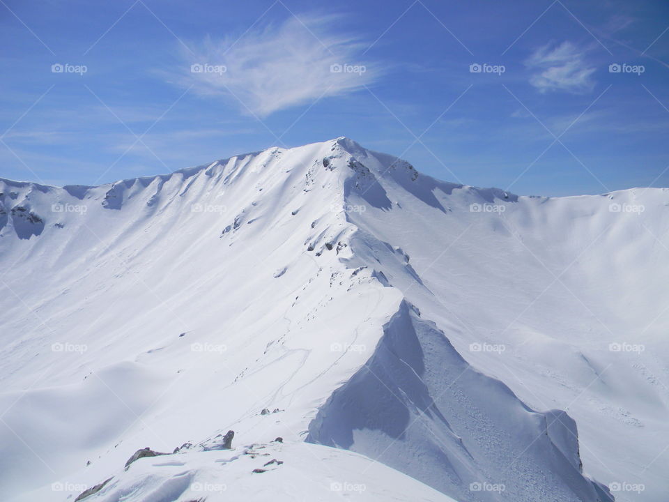 mountain ridge sun ice and snow