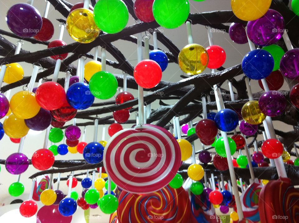bright colorful lollies. decorations hanging from ceilings 