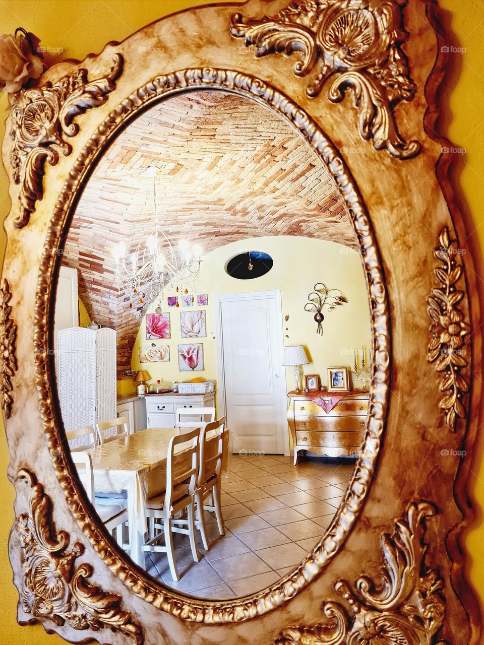 shabby chic home decor photographed from a gold-framed mirror