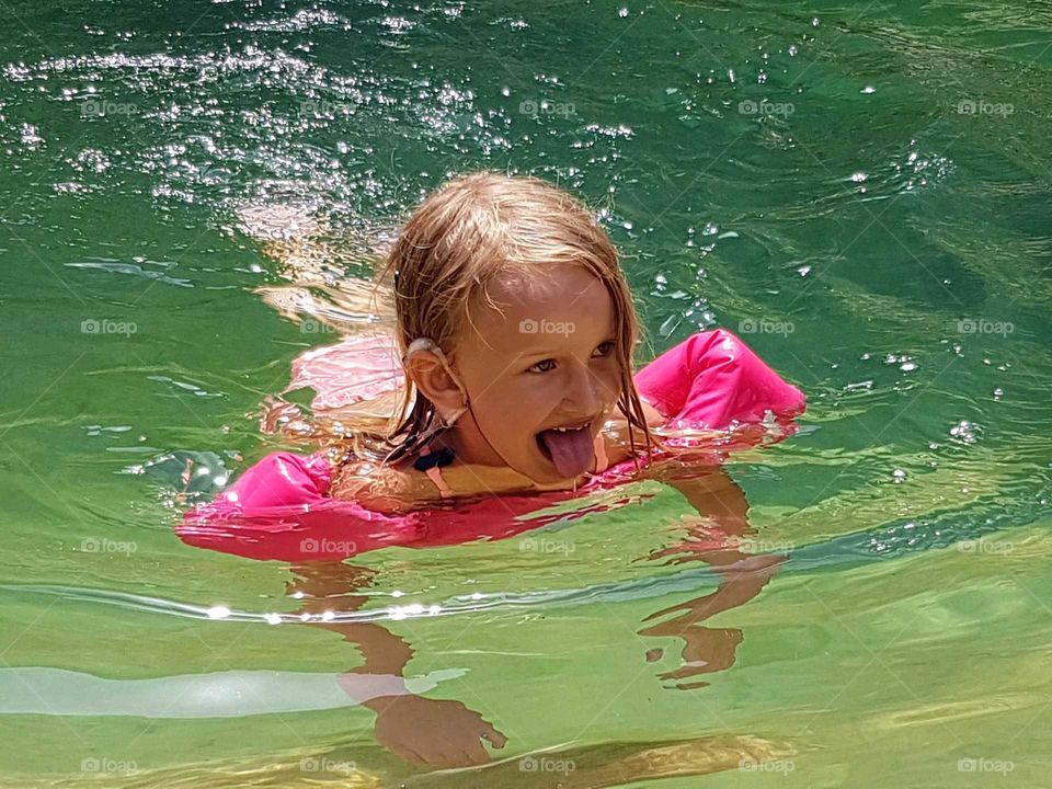 Girl in clear green water